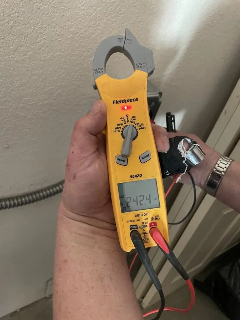 Voltage testing with clamp meter during Outlet Installation in Hollywood
